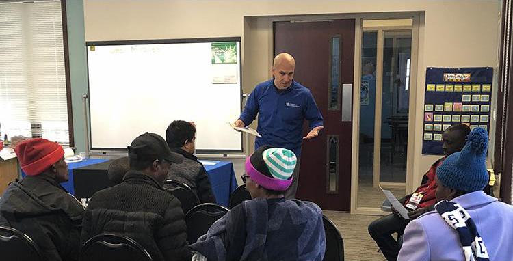 Jefferson County EFNEP assistant Omar Miralles Perez provides an educational program to participants with the Kentucky Refugee Ministries in Louisville. Photo provided by the Kentucky Nutrition Education Program.
