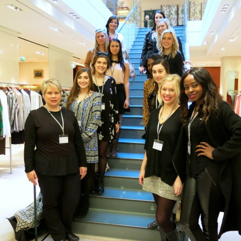 Dr. Scarlett Wesley (front left) and this year’s study tour students during an appointment with a fashion retailer.