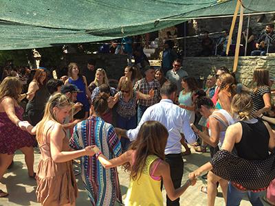 Students celebrating with locals on Ikaria