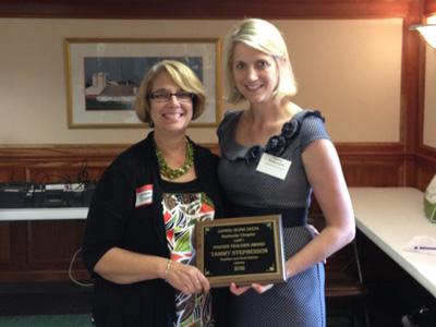 Dr. Stephenson receiving award from Dr. Bastin